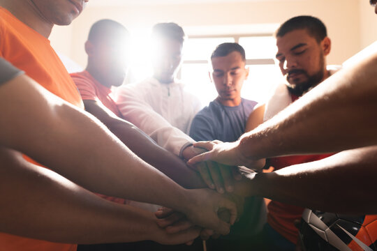 Multi ethnic group of male football in changing room