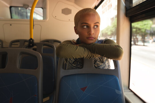 Mixed race alternative woman sitting in a bus