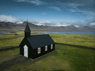 Fototapeta premium Black church Budakirkja aerial view from drone. West Iceland, Snaefellsnes (Snæfellsnes) peninsula