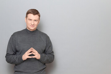 Portrait of happy confident proud mature man wearing casual jumper