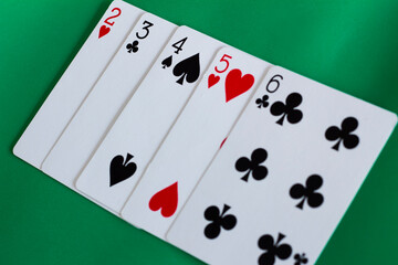 Straight Poker Casino Hand With Green Background