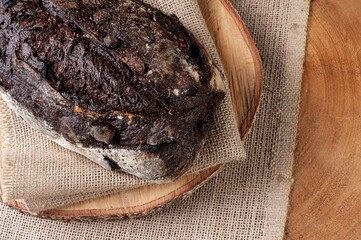 .Italian cocoa bread - Natural fermentation. Wood background. Top view
