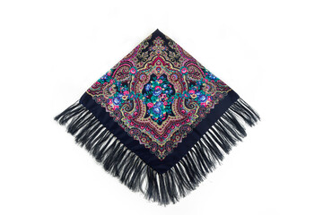 top view on folded black cotton scarf with fringe and bright floral ornament
