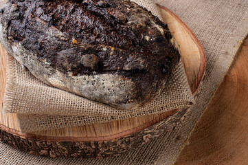 .Italian cocoa bread - Natural fermentation. Wood background. Top view