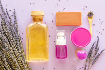 Lavender Soap, Lavande oil, lavander hydrolyte and bouquet on violet background, Homemade cosmetics, Beauty Concept