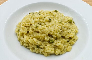 Risotto with asparagus on white dish