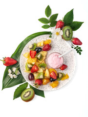 food photography of summer tropical fruit salad with yogurt sauce top view, on white background isolated with leaves and flowers close up