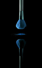makeup brush with colored powder