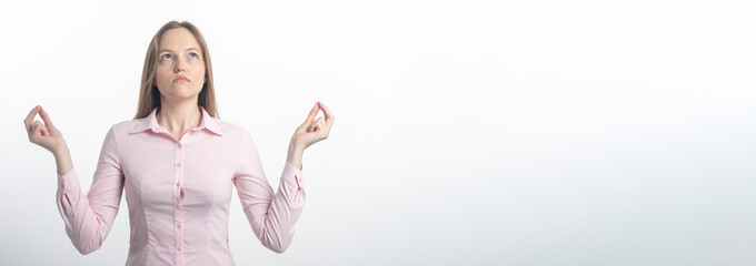 Everything zen. Calm and peaceful happy relieved young woman relaxed standing in meditation pose with hands sideways practicing yoga, stress-free over white wall, copy space for text, banner