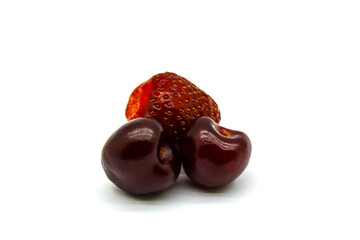 Two cherries and one strawberry