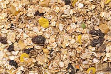 oatmeal with raisins, coconut, pineapple and banana slices isolated on a white background. For packing oatmeal or granola.