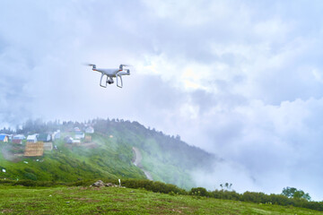 Fototapeta na wymiar White drone helicopter with digital camera