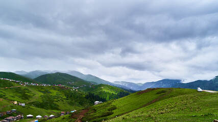 Fototapeta na wymiar Landscape of a mountains village in the clouds in Georgia