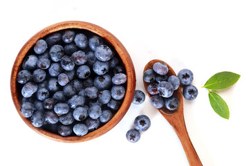 Blueberries in a bowl for breakfast with a spoon.
