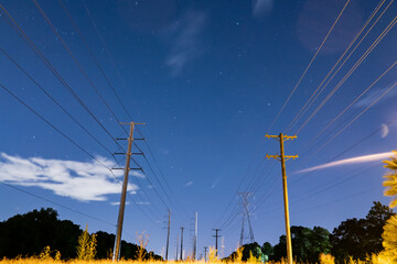 Neowise, a comet in the evening sky with high voltage electronic pole