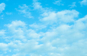 Naklejka na ściany i meble Blue sky with white Cumulus clouds. Atmosphere. Background. Natural phenomenon. 