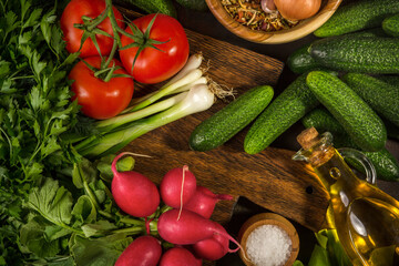 Fresh vegetables-cucumbers, tomatoes, radish and greens for salad. Useful proper nutrition.