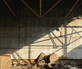 Old abandoned warehouse, view of the wall with garbage
