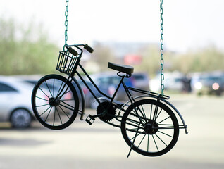 Bicycle-suspension on chain. Symbol of  healthy lifestyle.