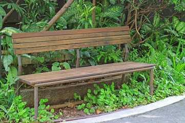 Fototapeta premium Empty old wooden bench in the garden
