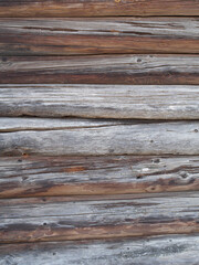 Wooden aged weathered rough log cabin background, wood texture
