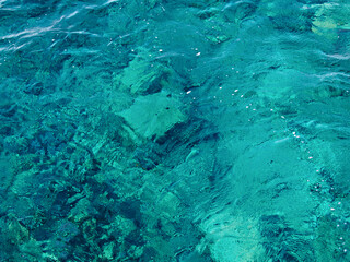Water sea surface with coral reefs background