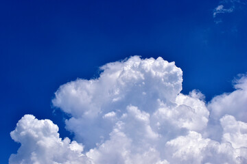 Naklejka na ściany i meble Blue and white storm Cumulus clouds before bad weather