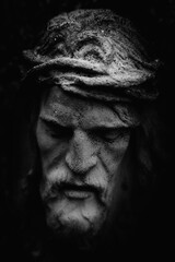 Antique statue of suffering of Jesus Christ crown of thorns. Black and white image.