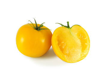 Ripe yellow tomato and juicy half isolated on white background 