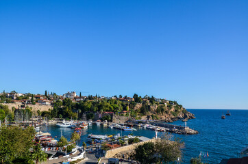 View of the of yacht harbor and red house roofs in the old town of Kaleici in Antalya, Turkey