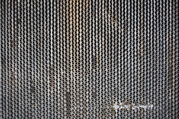 The structure of the metal grid from an old battery.