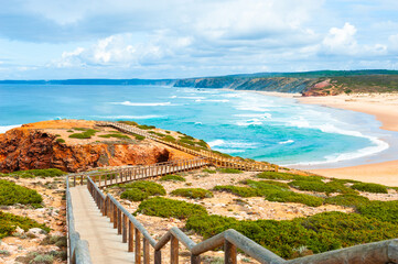 Beautiful shore of Atlantic ocean and stairs to the beach. Algarve, Portugal. Famous travel destination