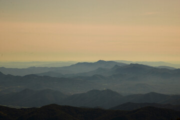 Layers of mountains under a clear sky