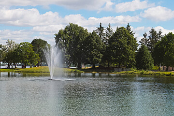 People enjoying a park and sailing on the water