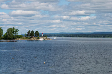 People enjoying a park and sailing on the water