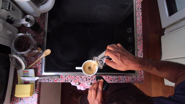 Top view person preparing bulletproof coffee with pods
