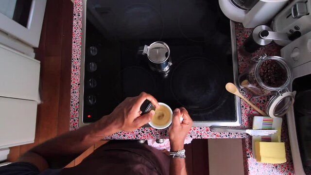 Top view person preparing bulletproof coffee with pods