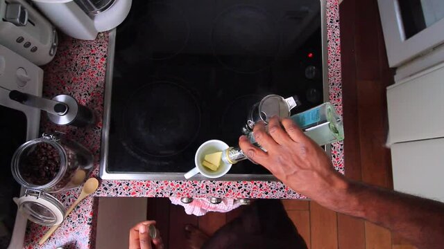 Top view person preparing bulletproof coffee with pods