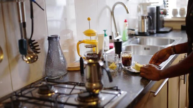 Top view person preparing bulletproof coffee with pods