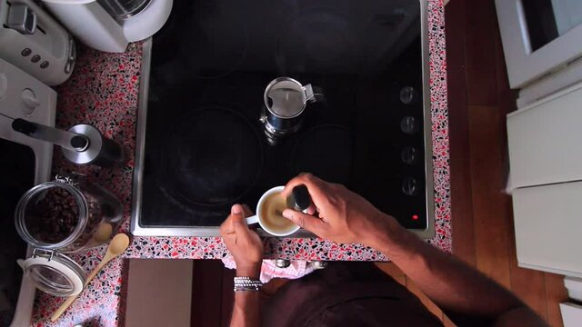 Top view person preparing bulletproof coffee with pods