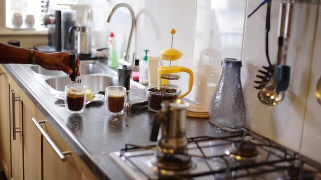 Top view person preparing bulletproof coffee with pods