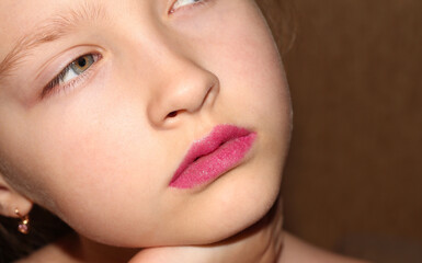 Beautiful girl with pink fluffy lipstick. Photo without retouching.