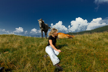 girl and horses in the carpathians