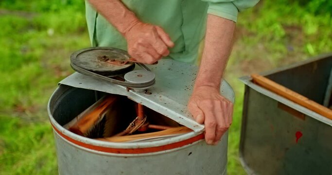 Close-up pumping honey in a honey extractor. Fresh honey, eco-friendly product. 4k, 10bit, ProRes