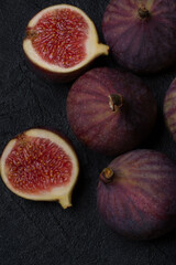 Fresh figs close-up on a black textured background