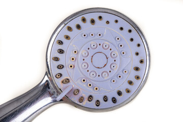 Old dirty shower head. Strong dirt in the home bathroom.