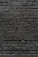 brick black wall texture. background of a old brick house.