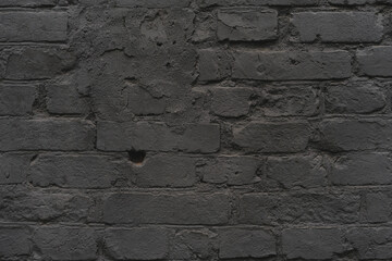 brick black wall texture. background of a old brick house.