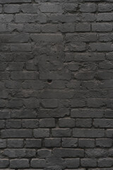 brick black wall texture. background of a old brick house.