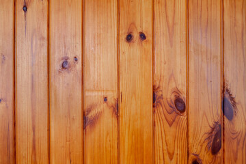 varnished wood wall from vertical planks. Background texture. Close up.